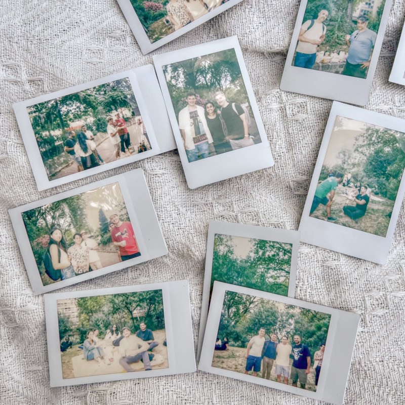 Polaroid photos of the Capsule team together on an outing and in a park.